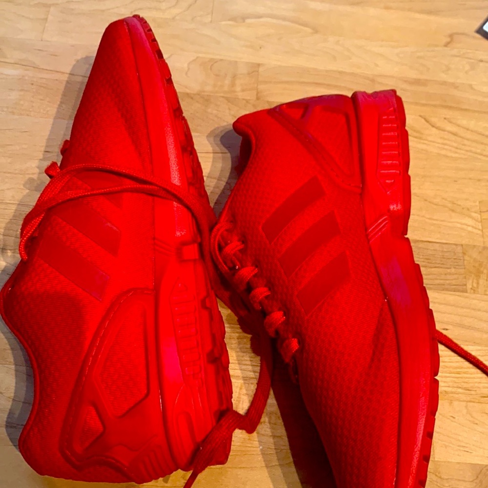 Red adidas flux zx. Barley worn